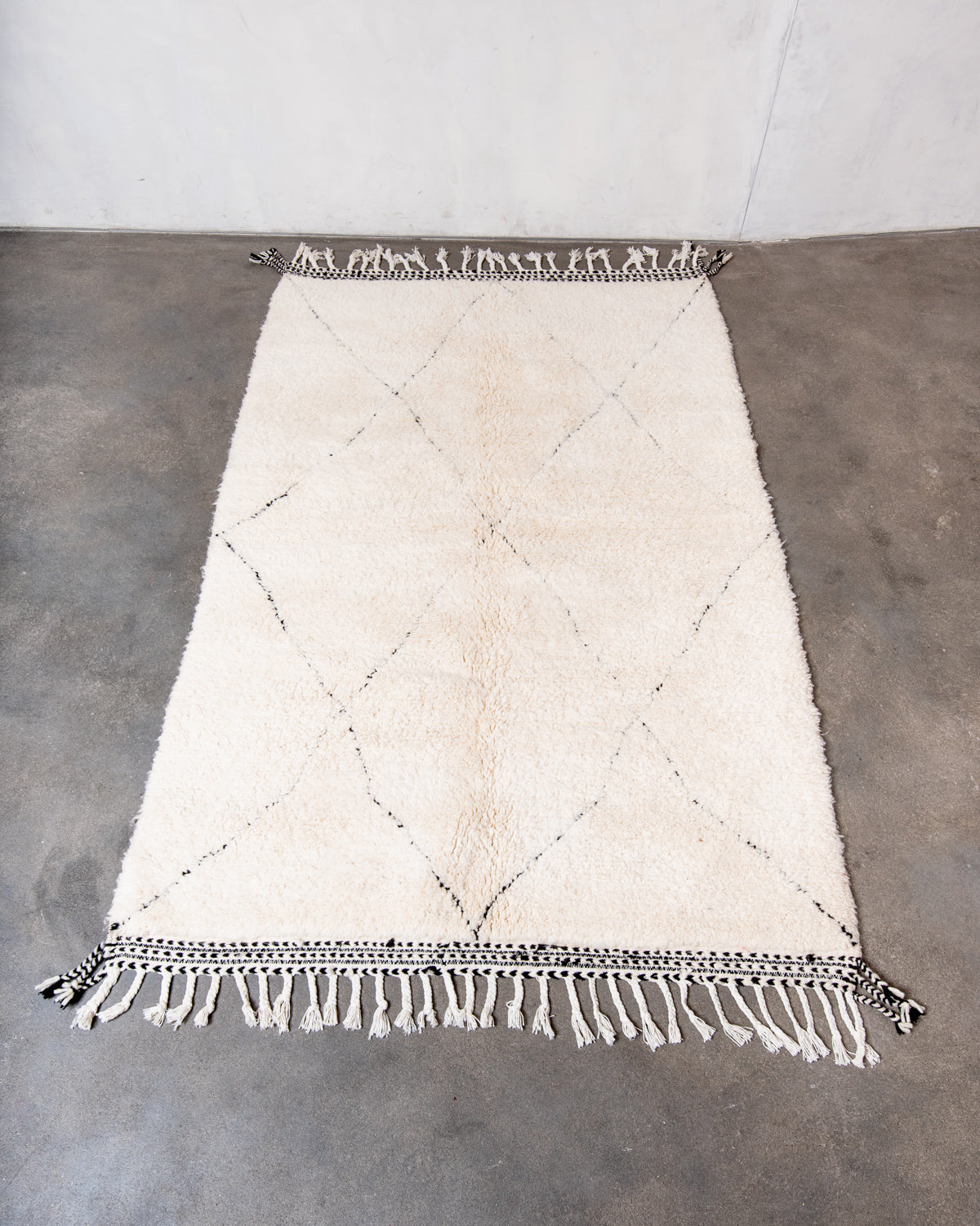 Modern, designer, handcrafted Berber rug from Morocco. Beniourain carpet with minimalist design, natural wool pile and a fluffy texture.